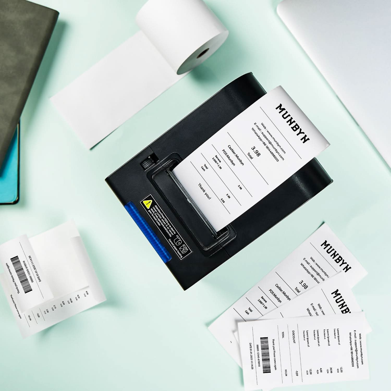 MUNBYN thermal receipt paper roll for point of sale printers, showing white paper roll ready for printing receipts.