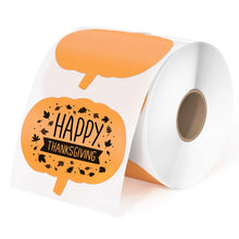 A roll of orange pumpkin-shaped direct thermal stickers