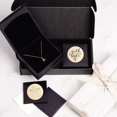 Two-inch gold label sheets for MUNBYN label printer, featuring shiny gold paper with printed labels ready for application.