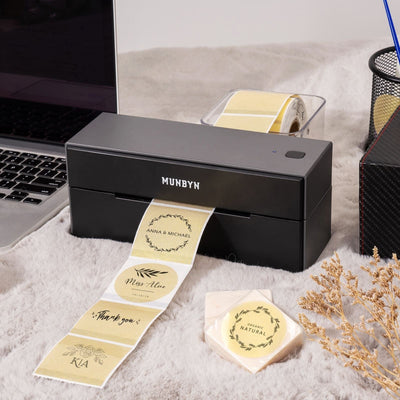 Six 2-inch gold labels printed on MUNBYN label printer paper, showcasing shiny gold finish and adhesive backing.